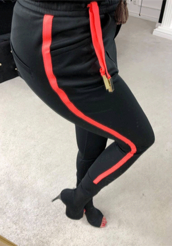 Czarne spodnie dresowe z różowym lampasem